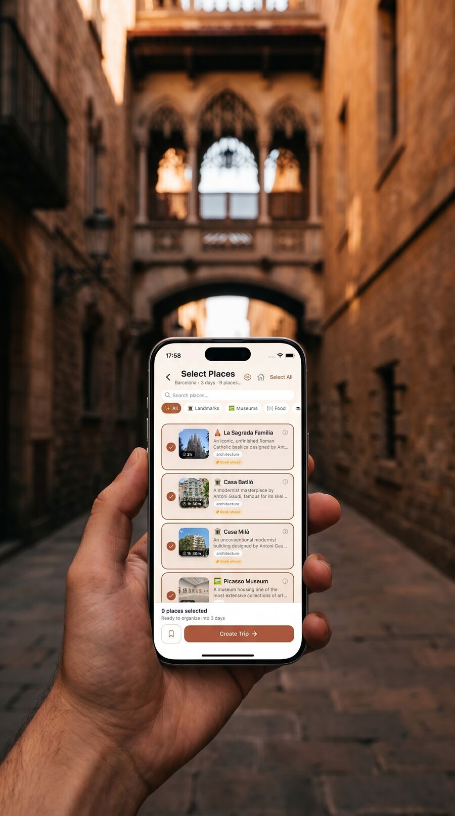 Hand holding iPhone showing Placeful Select Places for Barcelona in front of the Gothic Quarter